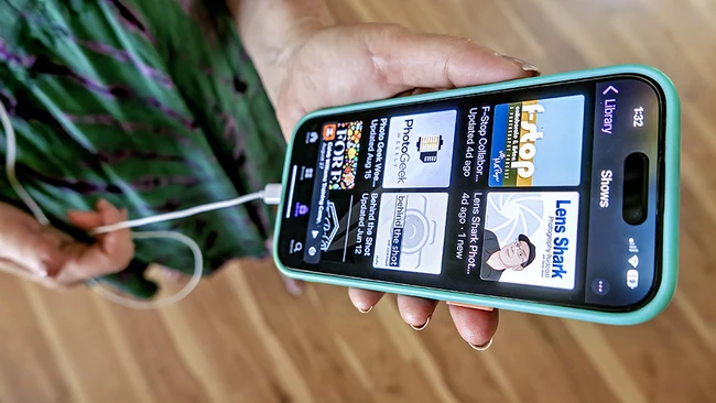 Smartphone displaying a photography education website with course listings and instructor profiles.