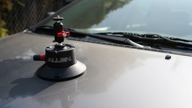 Allen suction cup camera mount mounted on vehicle hood with ball head