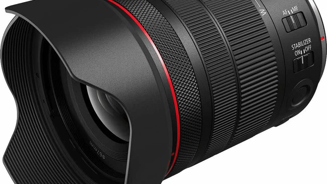 Canon RF-mount telephoto zoom lens with hood and red accent ring