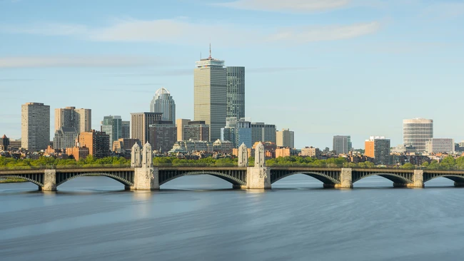 Boston skyline and Longfellow Bridge spanning the Charles River at golden hour
