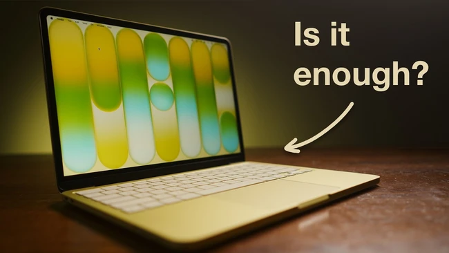 Laptop displaying colorful gradient test pattern with text asking 'Is it enough?'