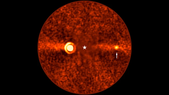 Thermal or infrared imaging illustration showing a circular red sphere with two bright hot spots and a central crosshair marker