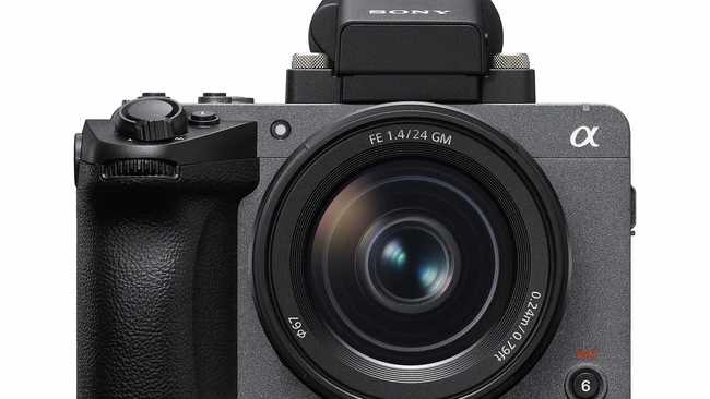 Sony α mirrorless camera with 28mm lens and pop-up flash against white background