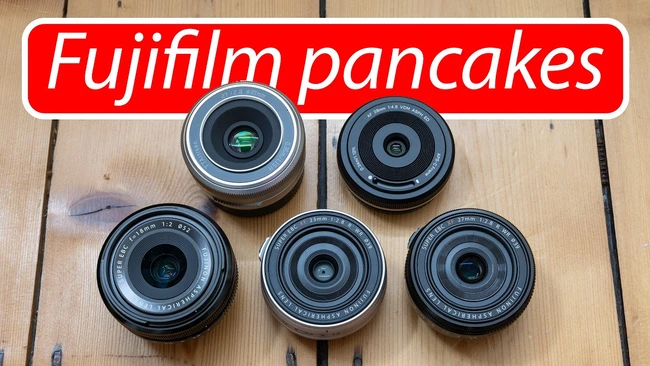 Five Fujifilm pancake lenses arranged on wooden surface with red text overlay