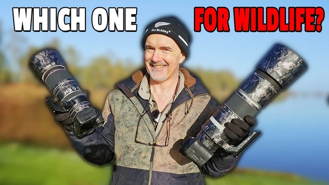 Wildlife photographer holding two telephoto lenses in outdoor setting with water and trees in background