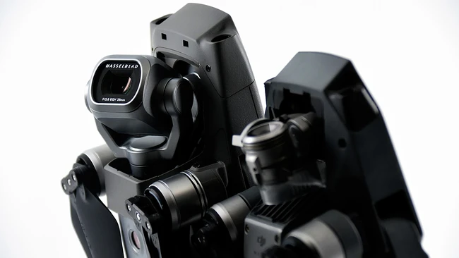 Professional camera rig with dual cinema lenses and integrated viewfinder mounted on rails