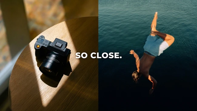 Split-screen comparison with compact camera on wooden surface and person diving into turquoise water with text overlay 'SO CLOSE'
