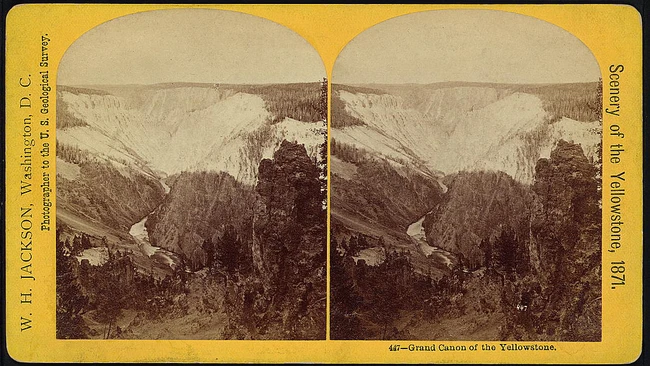 Stereoscopic card showing the Grand Canyon of the Yellowstone with river and forested canyon walls