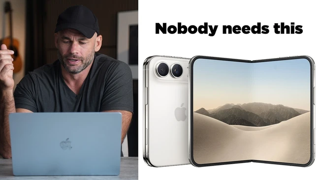 Man in black cap and shirt skeptically reviewing a foldable smartphone device