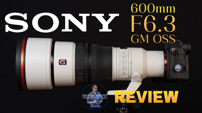 Sony 600mm F6.3 GM OSS telephoto lens positioned horizontally with camera body attached on right side