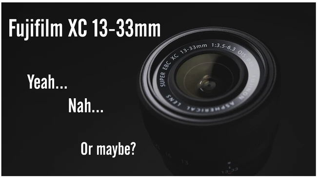 Graphic illustration of Fujifilm XC 13-33mm lens with indecisive text overlay
