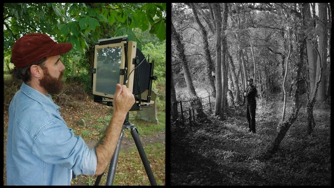 Photographer using large format camera on tripod in forest setting