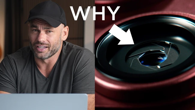 Man in black cap and shirt with arrow pointing to abstract black and blue spherical object