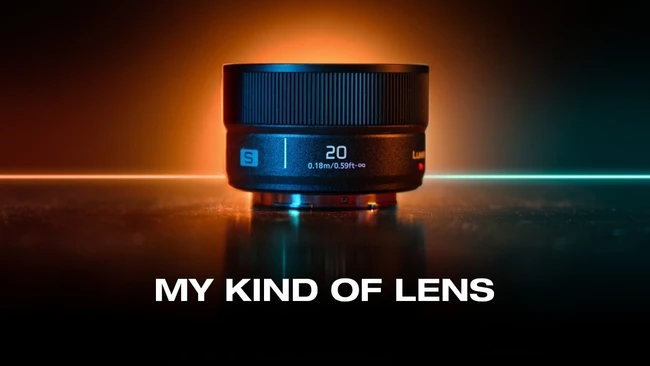 Prime lens with blue accent lighting and glowing orange and teal background