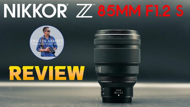 Video review thumbnail showing the Nikon Z 85mm f/1.2 S lens standing upright on a dark surface with bold 'REVIEW' text.