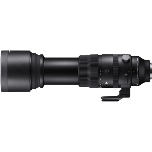 Black telephoto lens with attached teleconverter mounted on side plate.