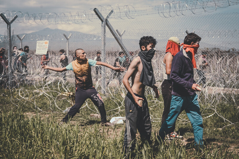 young men barbed wires