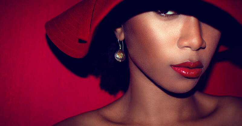 woman hat red earring