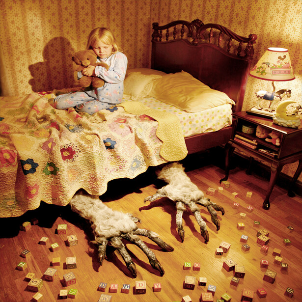 Monster under the bed in a little girls room