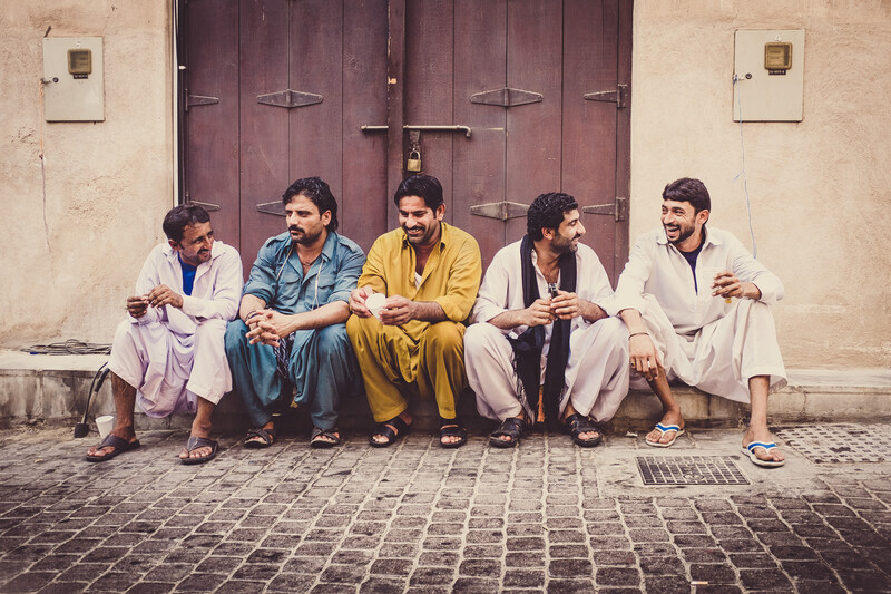 Portrait of a group of friends laughing. Captured in Dubai.