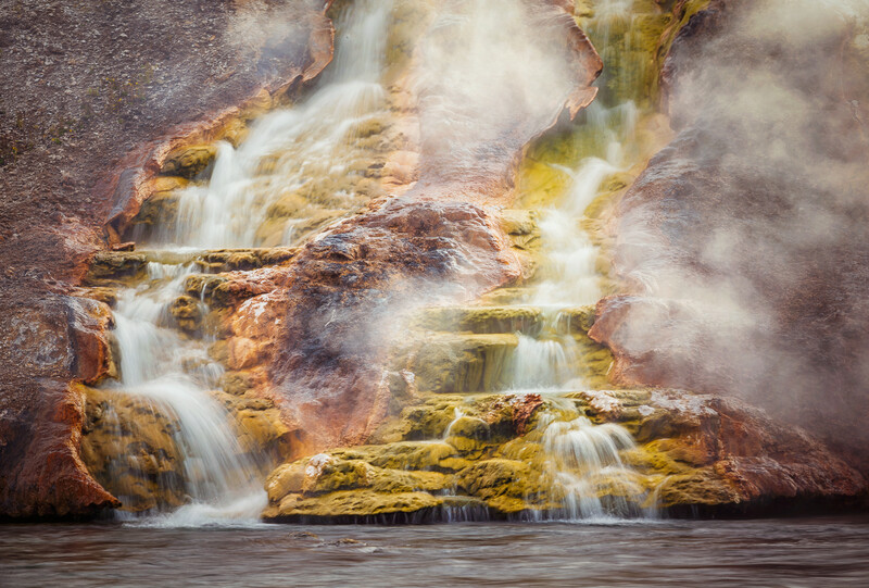 daytime shot of a hot spring in yellowtone national park
