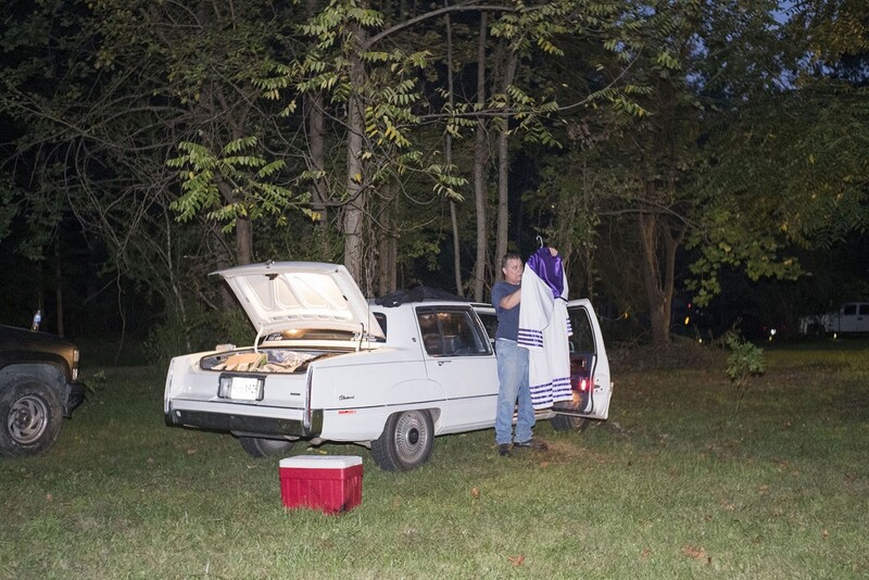 A KKK members puts away his robe after a BBQ and cross lighting/burning ritual in Maryland. (Peter van Agtmael/Magnum Photos)