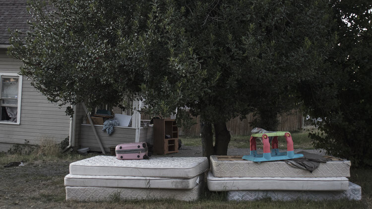 A reservation home showing signs of poverty