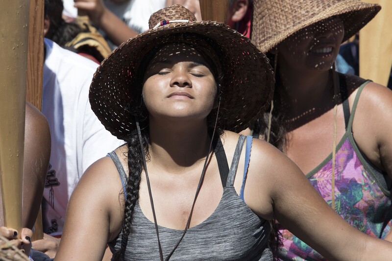 Native woman soaks up the sun in a canoe. Photo by Gabrielle Colton