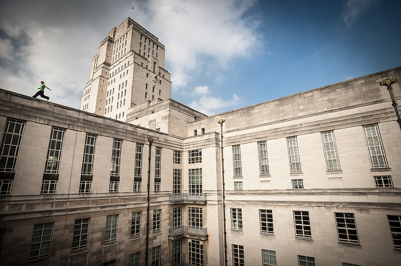 Flynn Disney exploring the rooftops of Senate House, London. Image by Andy Day.