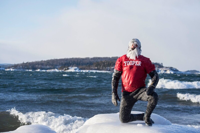 Surfer Dan poses with epic ice beard after surfing on Lake Superior Christmas Day