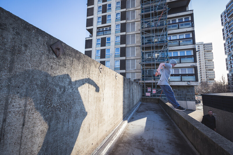 A parkour athlete jumping between walls. Andy Day.
