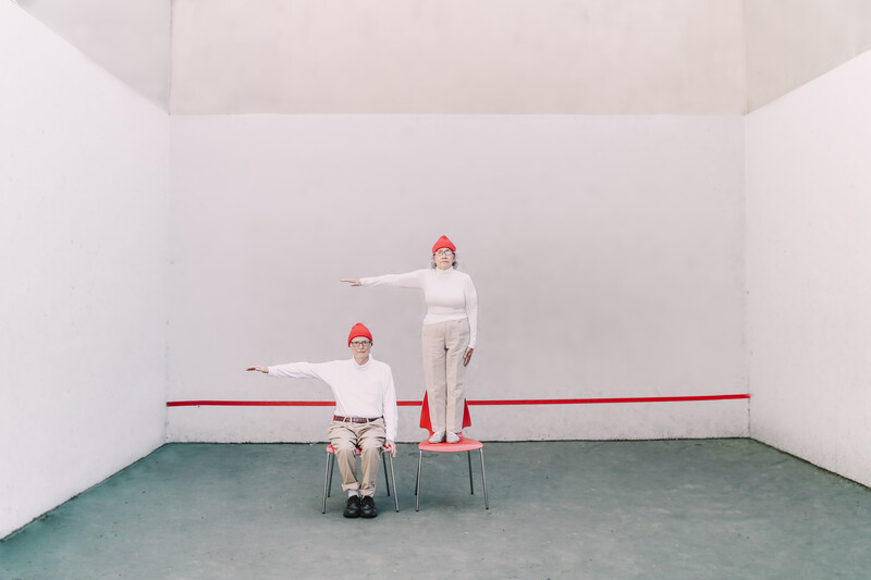 An elderly couple in casual clothes.