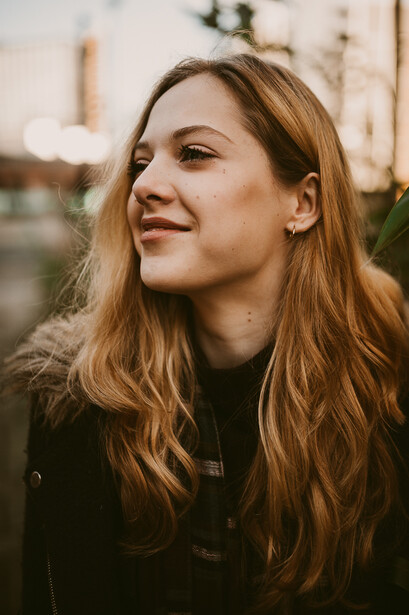 Young blond girl in a parka.