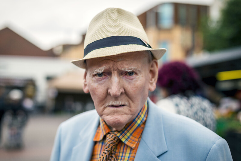A senior man with a hat.