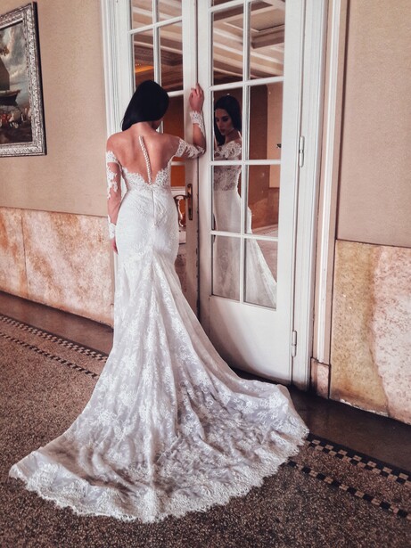 Bride with a wedding dress in a manor.