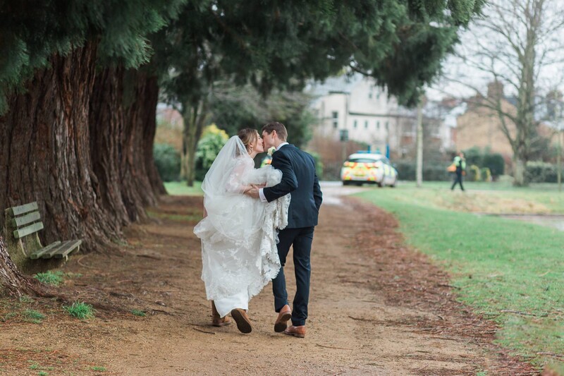 Bride and groom in a park.