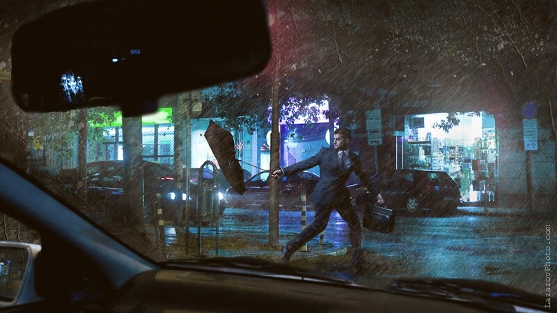 Business man with an umbrella in the rain