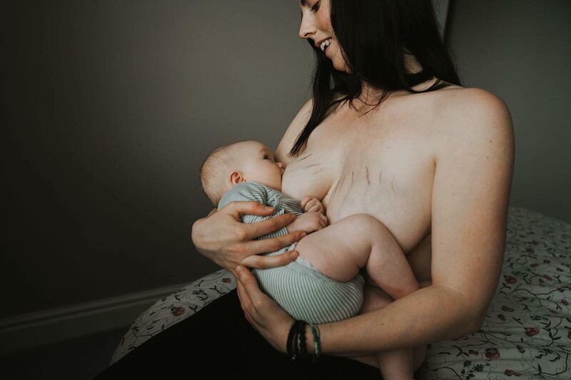 A mother breastfeeding her baby.