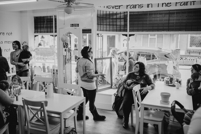 Mothers relaxing at a cafe.