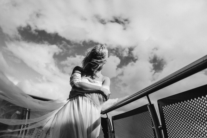 Bride on a windy rooftop