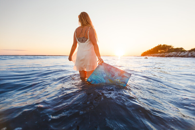 GIrl walking in the sea.