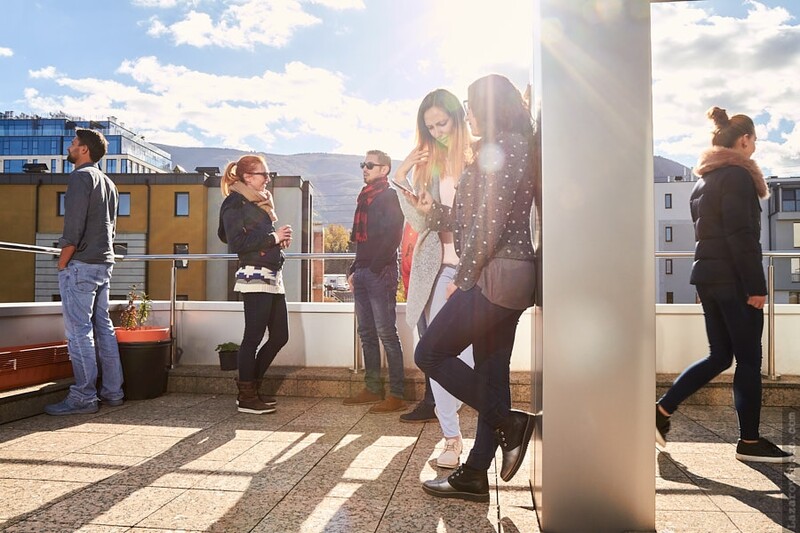 Workers socializing on the balcony