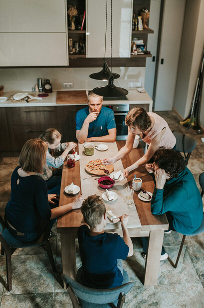 A family sharing a meal at the kitchen table