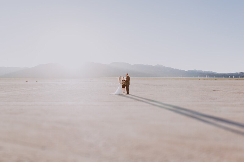 bride and groom getting married in an intimate elopement in the middle of the desert