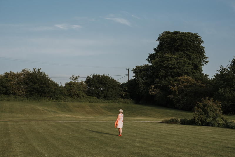 A wedding guest enjoying sunshine. 