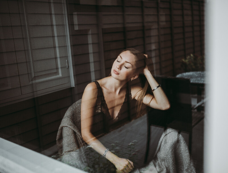 A young woman sat on an armchair