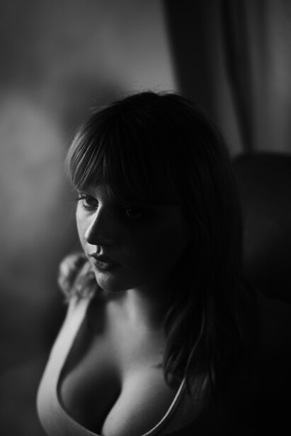 A portrait of a young woman with tattoos. 
