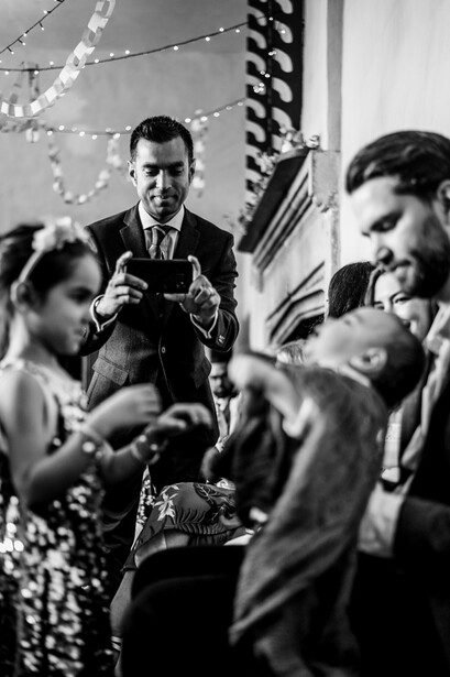 A father taking an image of his children