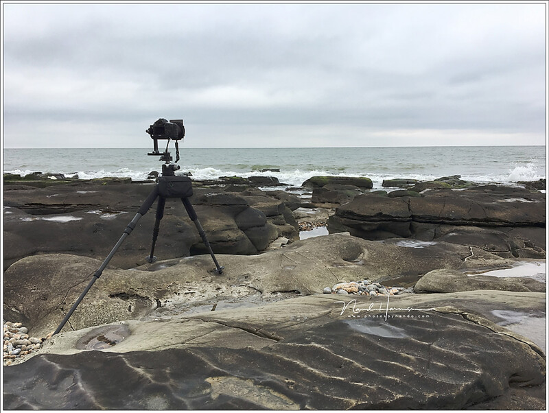 Although there is an uneven surface the tripod is placed level. This is the proper way.