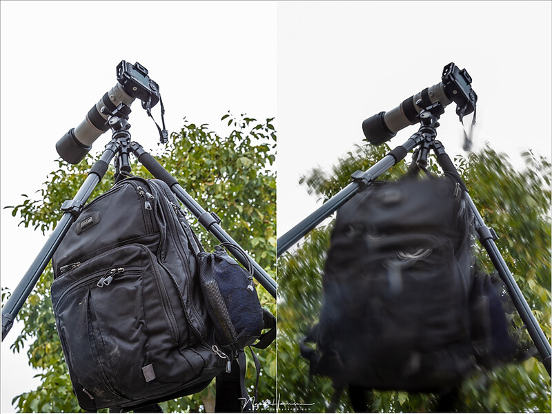 Use the hook to cary your bag. It seems to pull down the tripod for stability, but be careful it doesn't swing in the wind, or when you bump into it.